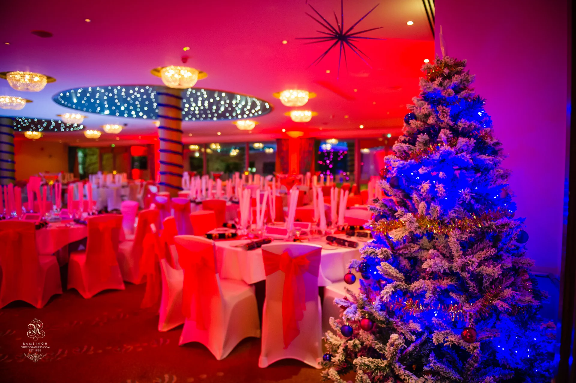 Celebration tables and lighting at Riverside Venue